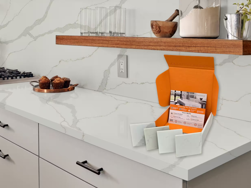 Men measure wall for granite intallation